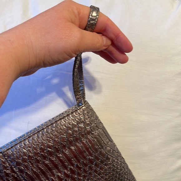 Neiman Marcus wristlet. Silver. Shine pulls bronze or gray depending. 9.5”x5.5” - Picture 8 of 8